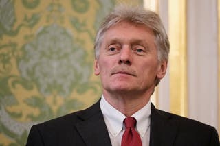 Kremlin spokesperson Dmitry Peskov waits before the talks take place at the Grand Kremlin Palace in Moscow